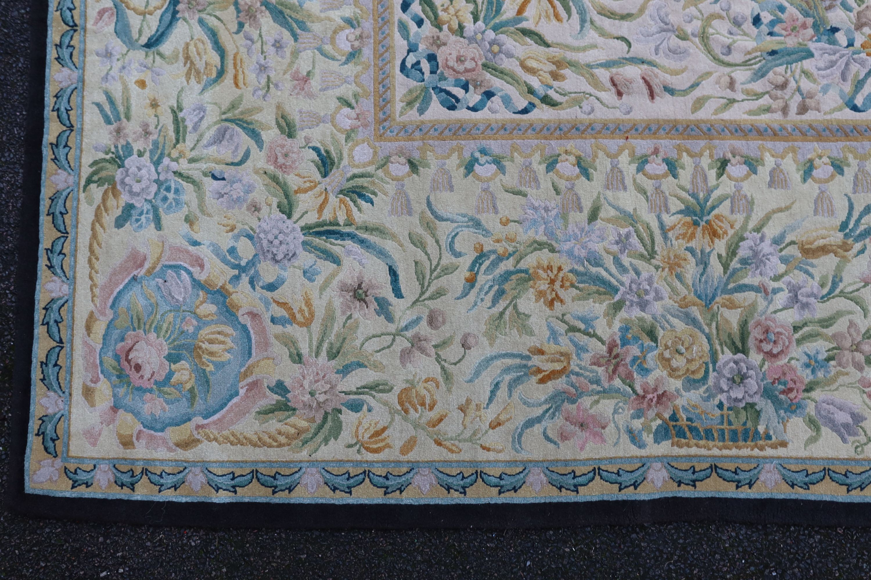 An Aubusson style ivory ground carpet, 372 x 274cm.